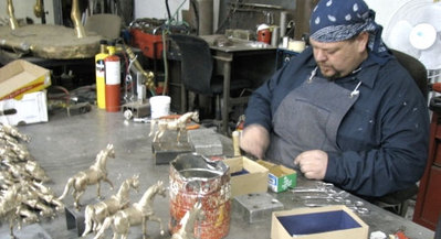 Carey Hosterman chasing with meticulous detail at Rocky Mountain Bronze Shop in Loveland Colorado